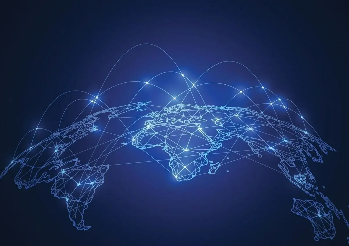Illuminated global network map representing cross-border connections for international hiring